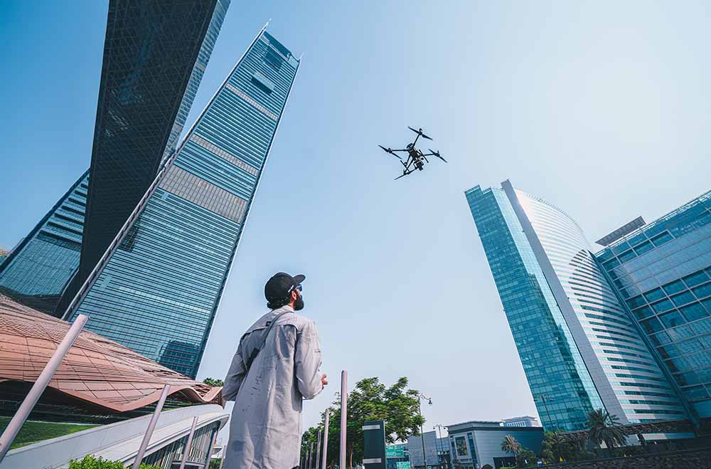 A pilot inspecting a high-rise building